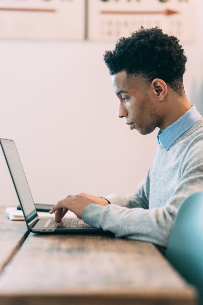 Man doing research on computer